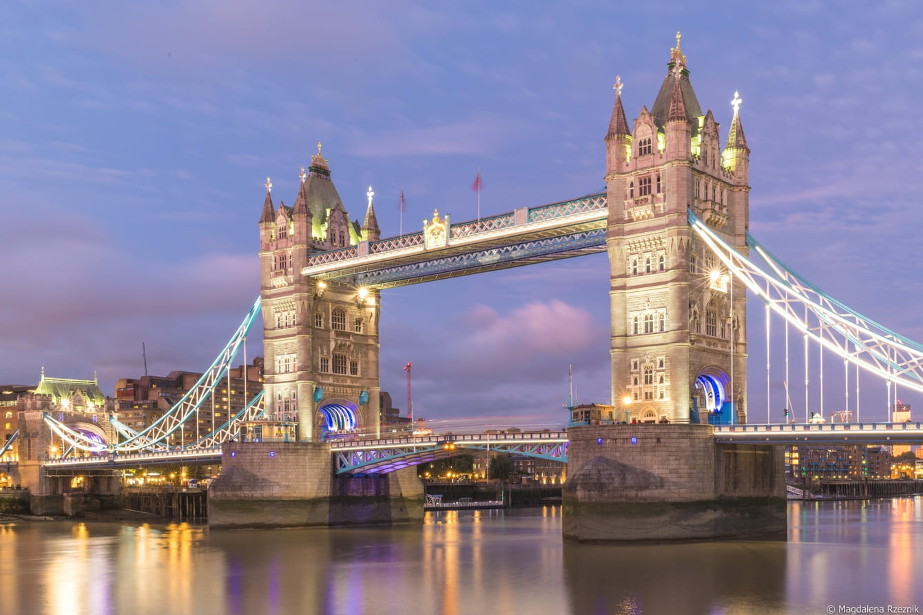 tower bridge surrounded by buildings lights evening london uk 1